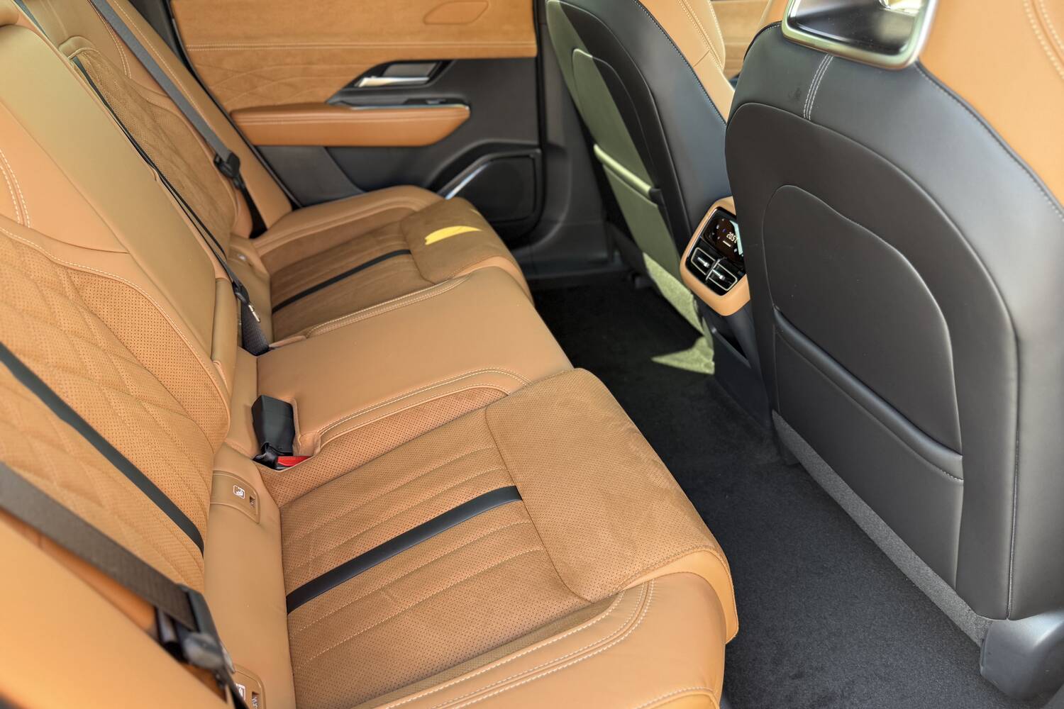 Check out the legroom (and distinctive upholstery) in the Mazda6e